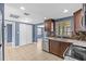 Spacious kitchen featuring stainless appliances, wood cabinets, and granite countertops at 9915 Aetna Ln, Port Richey, FL 34668