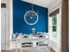 Inviting dining room with white furnishings, built-in bench, a unique wheel decoration, and natural light at 10197 Meadow Wren Ave, Weeki Wachee, FL 34613