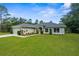 Charming single-story home featuring manicured lawn and attractive landscaping adding to the curb appeal at 10197 Meadow Wren Ave, Weeki Wachee, FL 34613