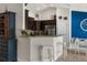 Stylish kitchen featuring granite countertops, stainless steel appliances, and cozy breakfast bar seating at 10197 Meadow Wren Ave, Weeki Wachee, FL 34613