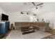 A well-lit living room with a comfortable sectional sofa, charming decor, and ample space for relaxation at 10197 Meadow Wren Ave, Weeki Wachee, FL 34613