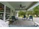 Enjoy the outdoors on this covered patio with views and a ceiling fan at 10197 Meadow Wren Ave, Weeki Wachee, FL 34613