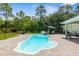 A beautiful outdoor space with a pristine pool and comfortable seating creating an inviting backyard oasis at 10197 Meadow Wren Ave, Weeki Wachee, FL 34613