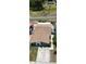Aerial view of a single-story home with a long driveway, brown roof and neatly maintained landscaping at 10325 Parkcrest Dr, Tampa, FL 33624