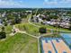 Aerial view of a neighborhood park featuring basketball courts and a playground adjacent to the property at 10325 Parkcrest Dr, Tampa, FL 33624