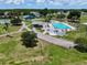 An aerial view highlighting a community pool and recreational facilities, enhancing the neighborhood's appeal at 10325 Parkcrest Dr, Tampa, FL 33624