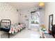Charming bedroom with star decals, neutral walls, and a window for natural light at 10325 Parkcrest Dr, Tampa, FL 33624