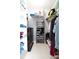 Walk-in closet with shelving, clothing rods, and a dark wood dresser for ample storage at 10325 Parkcrest Dr, Tampa, FL 33624