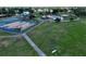 Aerial view of community amenities featuring tennis courts, basketball court, and recreational area at 10325 Parkcrest Dr, Tampa, FL 33624