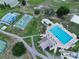 Aerial view showcasing the community pool and various recreational areas with lush landscaping at 10325 Parkcrest Dr, Tampa, FL 33624
