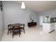 Bright dining area featuring a modern table, stylish chairs, and access to the outdoor space at 10325 Parkcrest Dr, Tampa, FL 33624