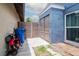 Side yard of home with storage shed, mower, trash can and wooden privacy fence at 10325 Parkcrest Dr, Tampa, FL 33624