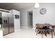Bright kitchen features stainless steel appliances and adjacent dining area with modern decor at 10325 Parkcrest Dr, Tampa, FL 33624