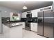 Spacious kitchen features stainless steel appliances, white cabinets, and granite countertops at 10325 Parkcrest Dr, Tampa, FL 33624