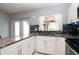 Updated kitchen with granite countertops, stainless steel appliances, and view of fenced backyard at 10325 Parkcrest Dr, Tampa, FL 33624