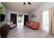 Stylish living room with modern furniture, hardwood floors, and a sliding glass door to the backyard at 10325 Parkcrest Dr, Tampa, FL 33624