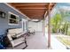 Spacious covered patio with outdoor seating, perfect for relaxing and enjoying the lush landscaping at 10325 Parkcrest Dr, Tampa, FL 33624