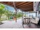Relaxing covered patio with comfortable seating and a slide in the background at 10325 Parkcrest Dr, Tampa, FL 33624