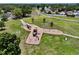 An elevated view of a playground featuring swings and slides set within a well-maintained park at 10325 Parkcrest Dr, Tampa, FL 33624