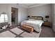Serene bedroom featuring a comfortable bed, stylish decor, and abundant natural light at 10464 Tranquil Meadow Loop, Riverview, FL 33569