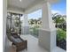 Inviting front porch featuring comfortable seating and picturesque neighborhood views at 10464 Tranquil Meadow Loop, Riverview, FL 33569
