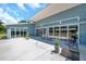 Large backyard patio with sliding glass doors offers seamless indoor-outdoor living at 10722 Sumner Rd, Wimauma, FL 33598