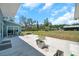 Expansive backyard patio provides serene views and ample space for relaxation and outdoor activities at 10722 Sumner Rd, Wimauma, FL 33598