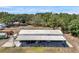Spacious pole barn with an expansive covered area, ideal for storage and projects at 10722 Sumner Rd, Wimauma, FL 33598
