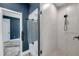 Modern bathroom featuring a glass shower with a matte black showerhead and light blue towel at 10722 Sumner Rd, Wimauma, FL 33598