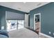 A spacious bedroom featuring a modern ensuite bathroom, and access to the outdoor living space at 10722 Sumner Rd, Wimauma, FL 33598