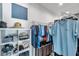 Organized walk-in closet with shelving, hanging racks, and ample storage space at 10722 Sumner Rd, Wimauma, FL 33598