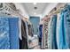 Walk-in closet featuring hanging racks and shelving for ample storage at 10722 Sumner Rd, Wimauma, FL 33598