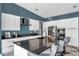 Stylish kitchen with a black marble island, modern cabinets, and stainless steel appliances at 10722 Sumner Rd, Wimauma, FL 33598