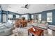 Open-concept living room with kitchen and dining area, perfect for entertaining at 10722 Sumner Rd, Wimauma, FL 33598