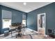 Bright home office featuring a work space, natural light, and a doorway to an adjacent bathroom at 10722 Sumner Rd, Wimauma, FL 33598