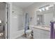 Bright bathroom with a shower-tub combo, white vanity, and a decorative shower curtain at 10764 70Th Ave # 3206, Seminole, FL 33772