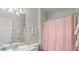 Bathroom featuring a vanity with sink, a toilet, and a shower with pink shower curtain at 10764 70Th Ave # 3206, Seminole, FL 33772