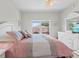 Comfortable bedroom featuring a bed, dresser, and a window with views at 10764 70Th Ave # 3206, Seminole, FL 33772