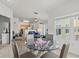 Open-concept dining room and kitchen area with modern appliances at 10764 70Th Ave # 3206, Seminole, FL 33772