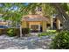 Mailboxes are in a covered structure surrounded by trees and shrubbery at 10764 70Th Ave # 3206, Seminole, FL 33772