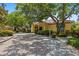 Exterior view of the community with mature trees and well-manicured landscaping at 10764 70Th Ave # 3206, Seminole, FL 33772