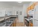 Bright kitchen featuring stainless steel appliances and a view into the living area at 10764 70Th Ave # 3206, Seminole, FL 33772