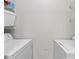 Clean laundry room with side-by-side washer and dryer units at 10764 70Th Ave # 3206, Seminole, FL 33772