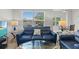 Cozy living room with comfortable couches, a glass table, and natural light from the window at 10764 70Th Ave # 3206, Seminole, FL 33772