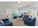 Comfortable living room with a blue sofa and a view of the bedroom at 10764 70Th Ave # 3206, Seminole, FL 33772