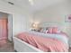Well-lit main bedroom featuring a bed, a lamp, and an ensuite bathroom at 10764 70Th Ave # 3206, Seminole, FL 33772