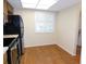 A cozy kitchen nook area with wood floors and natural light from window at 111 Lakeview Pl, Oldsmar, FL 34677