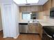 Efficient kitchen with a stainless steel dishwasher and ample counter space, offering convenience and functionality at 111 Lakeview Pl, Oldsmar, FL 34677