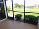 Relax on this screened in patio with a view of the community pond at 111 Lakeview Pl, Oldsmar, FL 34677