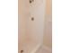 Shower featuring white tiled walls, white tiled floor, and chrome shower head at 111 Lakeview Pl, Oldsmar, FL 34677
